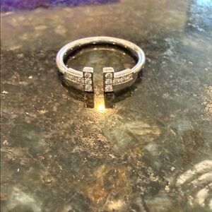 Authentic Tiffany T ring.  18k white gold. .13 total carat weight